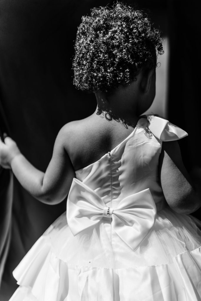 a black and white portrait of the flower girl at a south haven michigan wedding