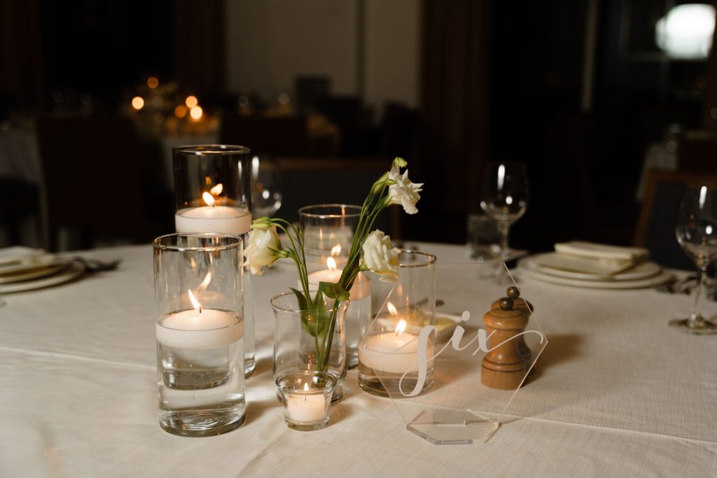 a photo of candles at table six at a shinola hotel wedding