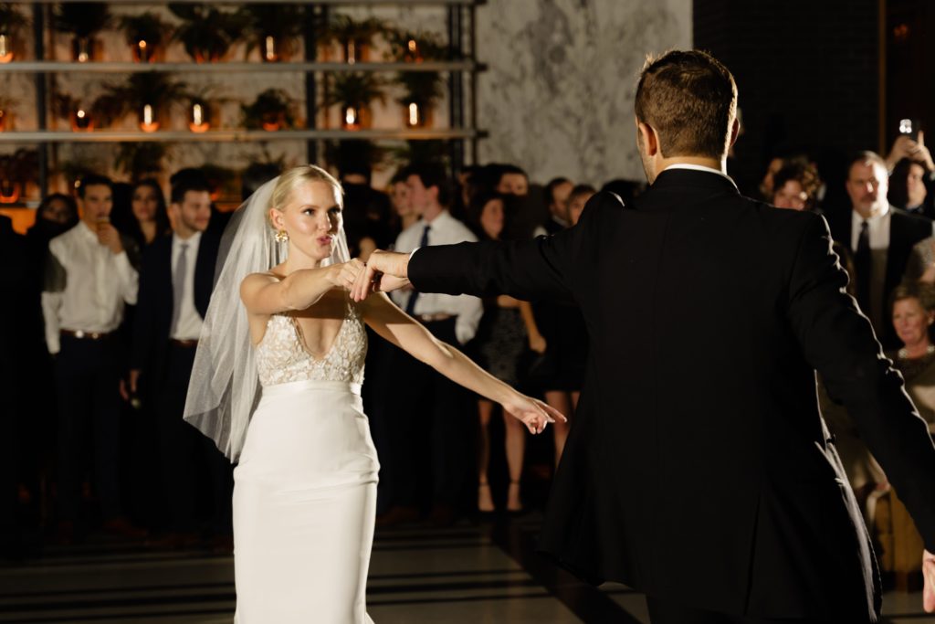 the bride and groom share a dance captured by a detroit wedding photographer