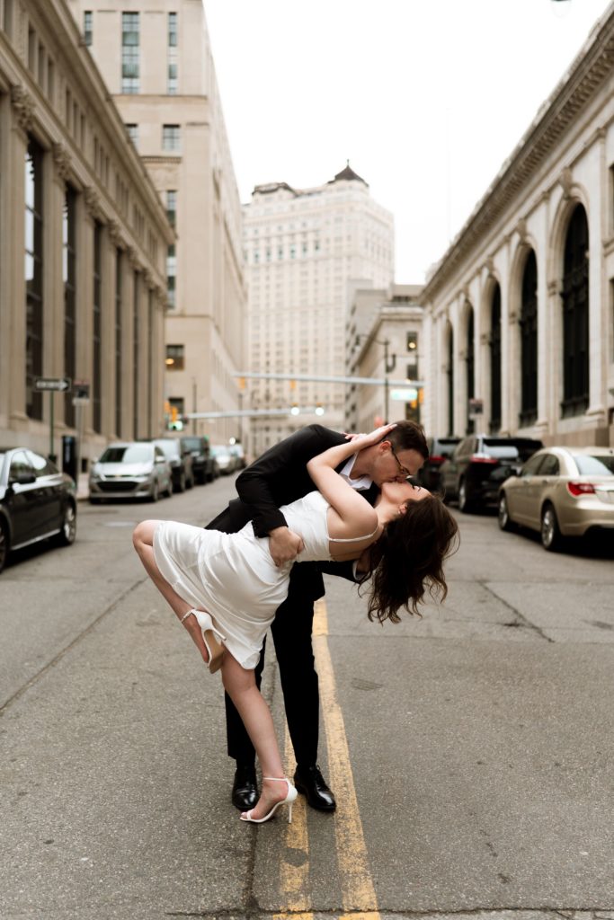 julia and drew kiss in the street during their engagement photoshoot