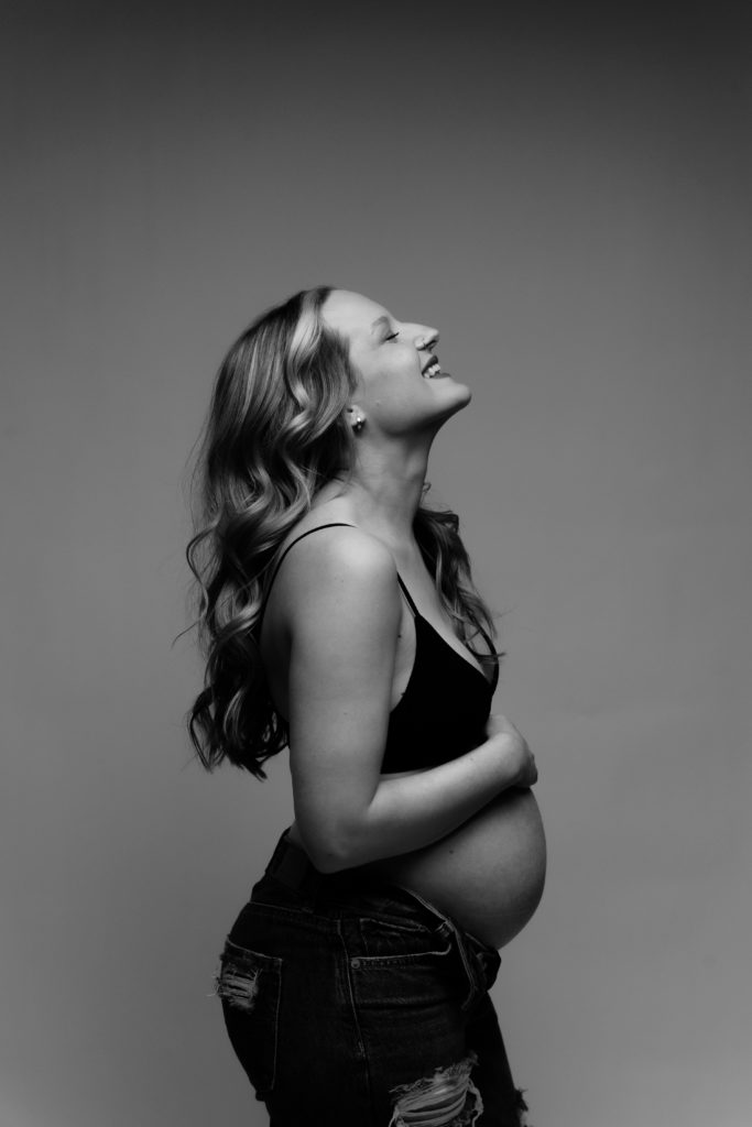 a side profile of an expecting mother during her maternity photoshoot