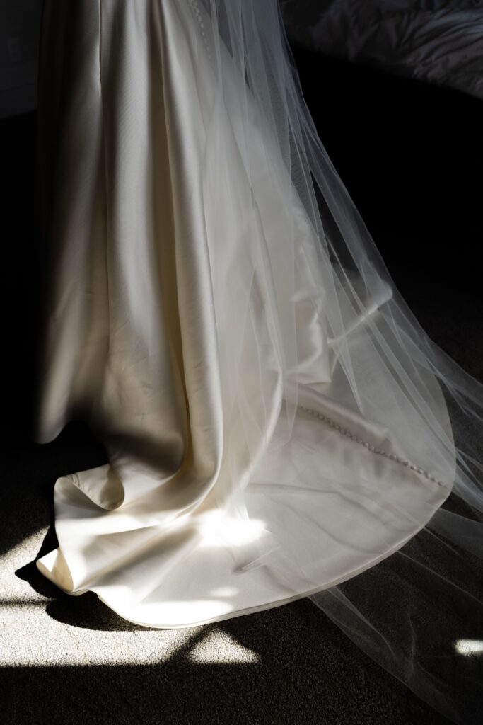 the bride's dress and veil in the sunlight