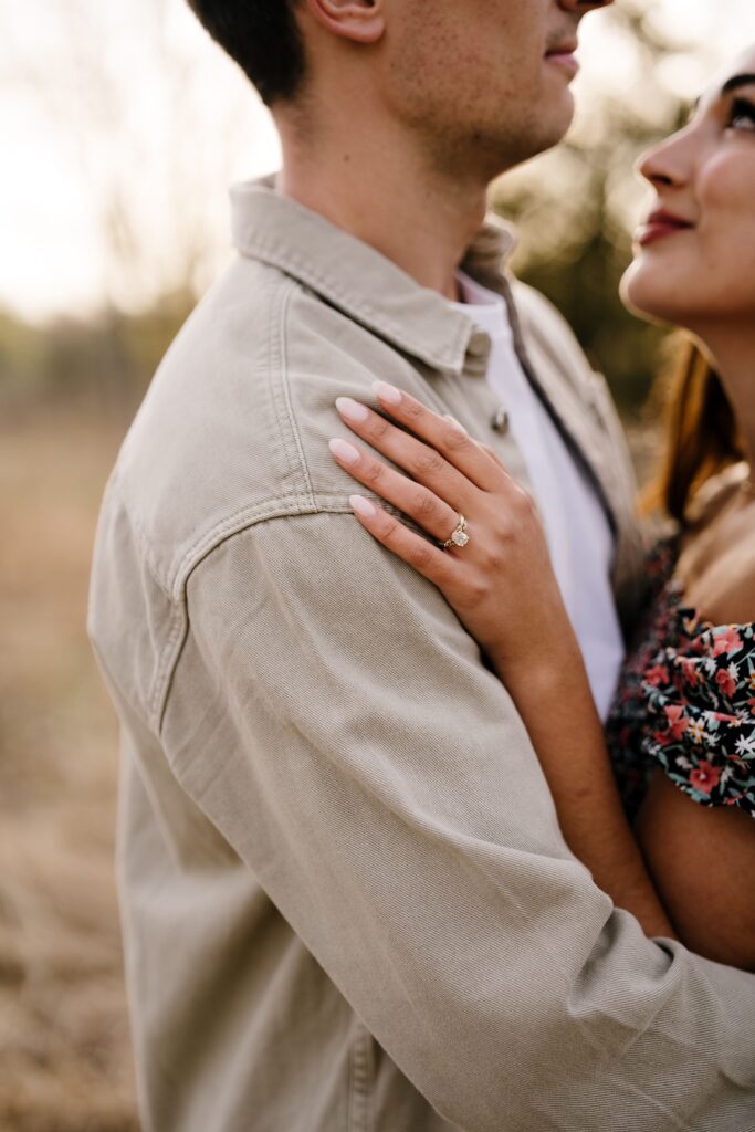 spencer and dalia share an embrace during their spring engagement photos - dalia flashes her engagement ring
