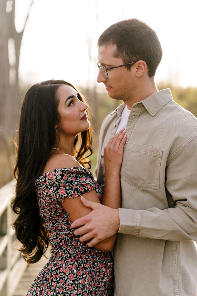 dalia and spencer look at each other during their session with a michigan engagement photographer